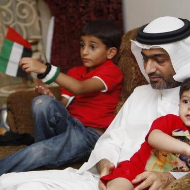 Ahmed Mansoor, one of the five political activists pardoned by the United Arab Emirates, plays with his children as he speaks to Reuters in Dubai on November 30, 2011. 