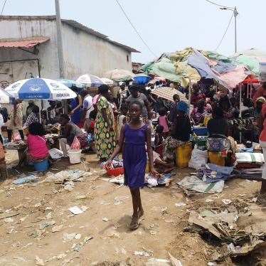 A young girl walks through the Buracos market, in the Angolan restive region of Cabinda, on April 9, 2019 in Cabinda, Angola.