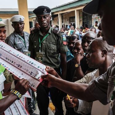 Officials count votes in front of voters during the presidential and parliamentary elections on February 23, 2019, at a polling station in Port Harcourt, southern Nigeria. 