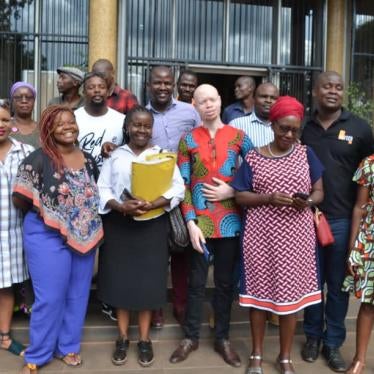 The seven activists, lawyer Jessie Majome (with yellow folder), family and friends outside Rotten Row Magistrates Court on January 8, 2020.