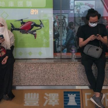 Residents use their phones during a protest in Hong Kong, November 11, 2019.