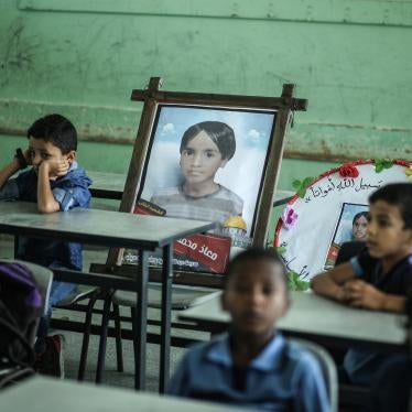 Children in Gaza sit on November 16, 2019 in a classroom near a picture of their classmate Mo’ath al-Sawarka, aged 7, one of five children killed in an Israeli airstrike two days earlier.