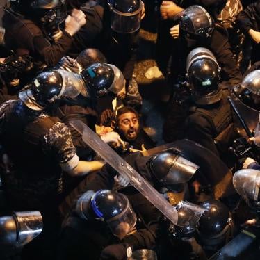 Riot police arrest a protester outside a police station in Beirut, Lebanon on Wednesday, January 15, 2020.