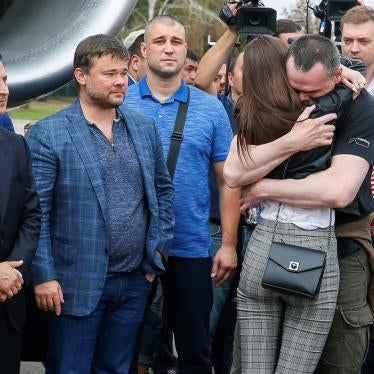 Ukrainian film director Oleg Sentsov, jailed on groundless terrorism charges in Russia, hugs his daughter at a welcoming ceremony at Borispil International Airport outside Kiev.