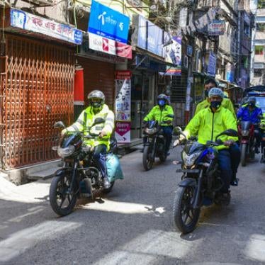 Police members wear protective equipment as they patrol the streets during the nationwide lockdown as a preventive measure against the Coronavirus outbreak, in Dhaka, Bangladesh, March 2, 2020. 
