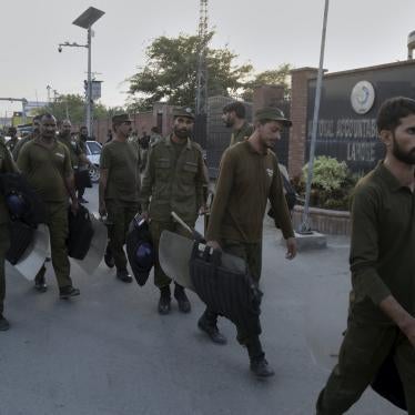 Police officers arrive at the office of the National Accountability Bureau, Lahore, Pakistan, October 5, 2018.