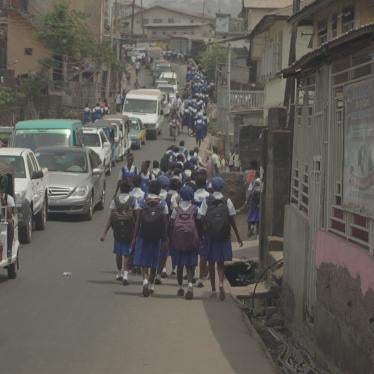 A group of students walk to school in Sierra Leone