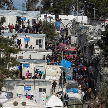 Asylum seekers and migrants in the Reception and Identification Center of Moria, Lesbos after a fire broke out, on March 16, 2020. 