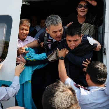 Kazakhstan's police officers push arrested protesters into a police bus during an opposition rally in Almaty, Kazakhstan, September 21, 2019. 