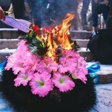 Symbolic burning of a funeral wreath during celebration of International Women's Day in Almaty, Kazakhstan, March 8, 2020.