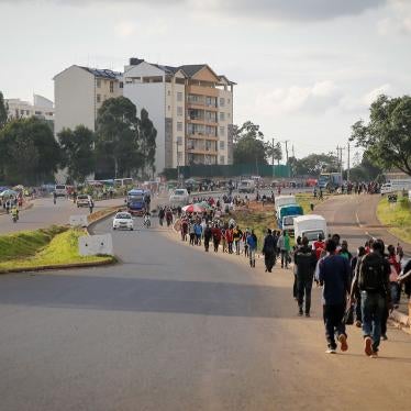Kenyans make their way home before the daily dusk-to-dawn curfew in Nairobi, Kenya, April 6, 2020.