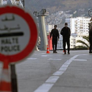 Security forces stand at a checkpoint to enforce a curfew aiming to prevent the spread of corona virus in Algiers, Algeria, April 8, 2020. 