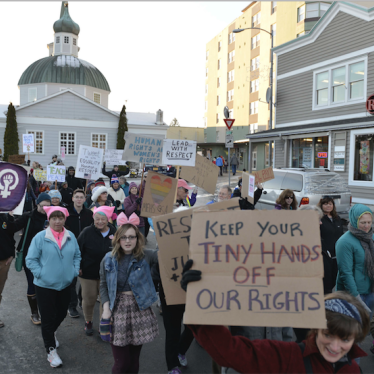 Hundreds of people march in downtown Sitka, Alaska, during the women's march, held in solidarity with the Women's March on Washington, Saturday, Jan. 21, 2017. 