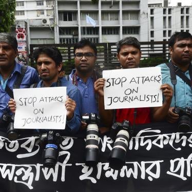 Bangladeshi photojournalists and journalists form a human chain infront of National Press Club protesting the attacks on them during the students' ongoing protest demanding safe roads, in Dhaka, Bangladesh on August 7, 2018.