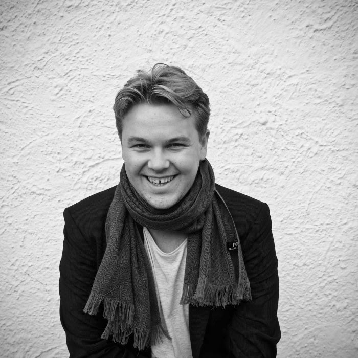 Photo of Theis seated