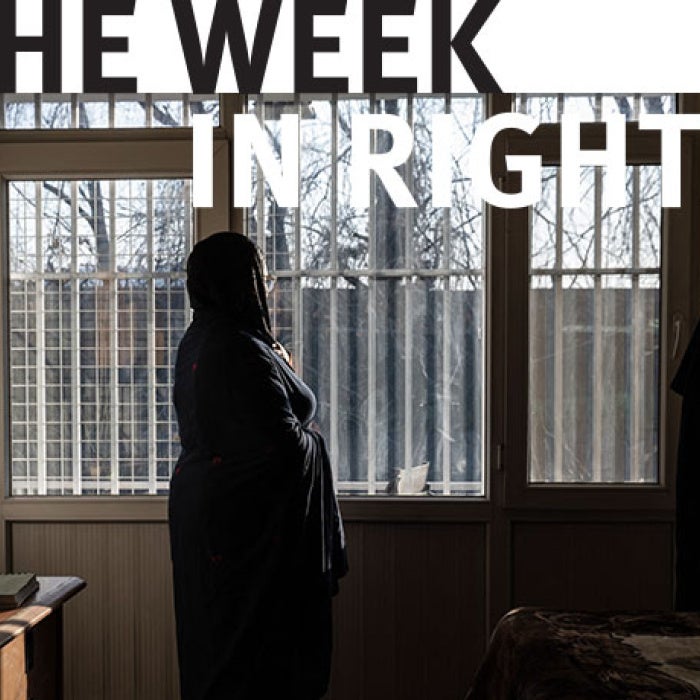 Silhouette of woman standing in classroom. 