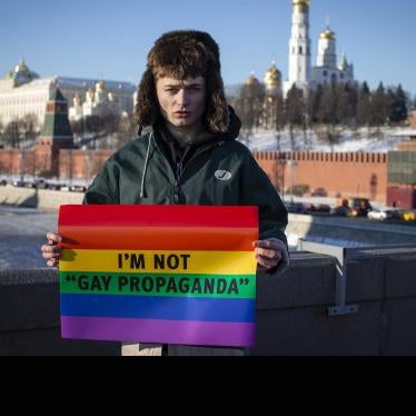 Russian blogger, Zhenya Svetski, stands with a sign reading “I am not ‘gay propaganda’” in Moscow, December 2018.